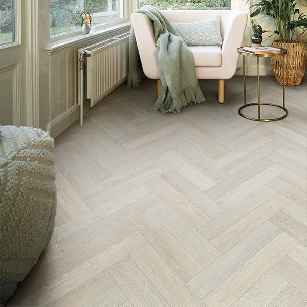 A classic herringbone wood flooring pattern with real character