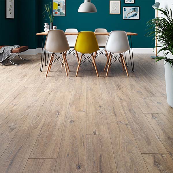 Wood-effect laminate flooring bringing warmth to a dining room