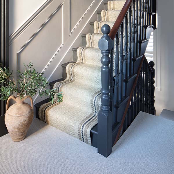 A carpet stair runner bringing texture to a staircase